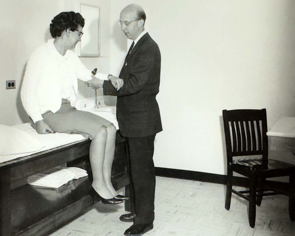 Guthrie orthopedic surgeon Albert M. Murtland, MD with a patient in 1960. Dr. Murtland was at Guthrie for nearly 50 years, first beginning his tenure as an intern under Dr. Guthrie himself.