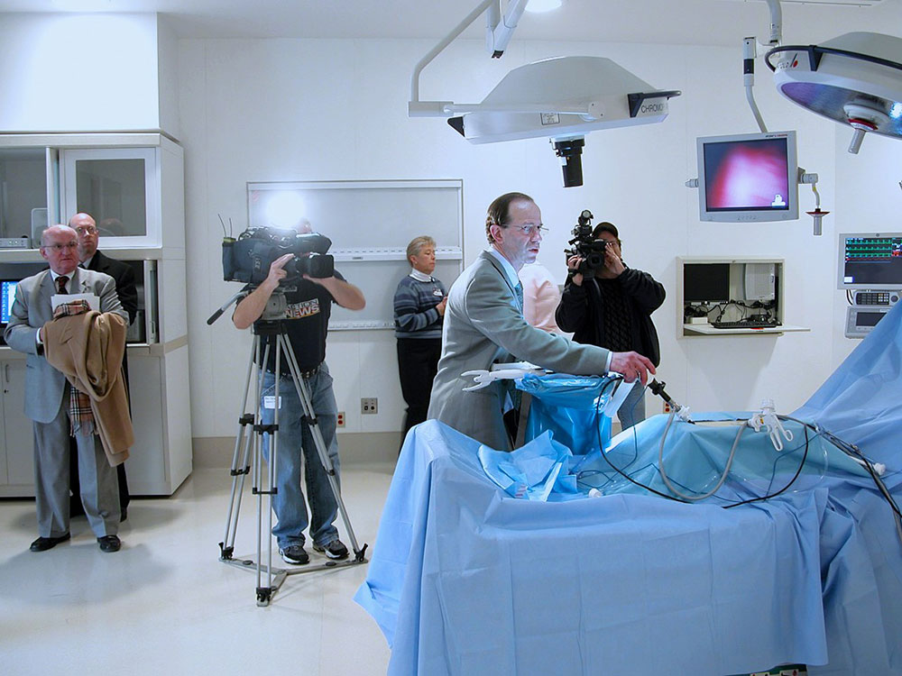 Chief Dr. Bob Cohen showing a new OR to members of the local media, 2005.