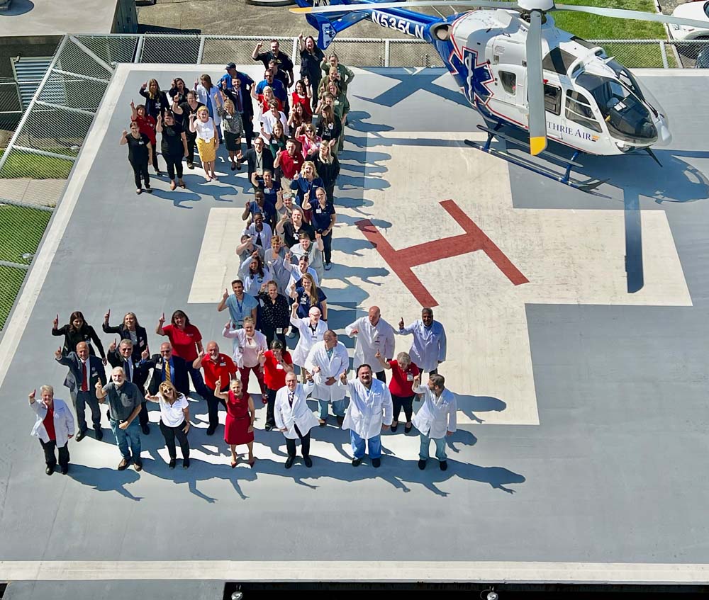 The Guthrie Robert Packer Hospital trauma team commemorates their Level I accreditation on one of the helipads, 2023.