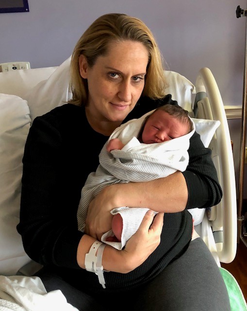 Mom holding newborn 
