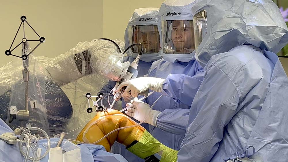 Residency Associate Program Director Jeffrey S. Lutton, MD supervising residents in the OR.