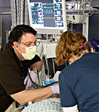 nurses treating patient