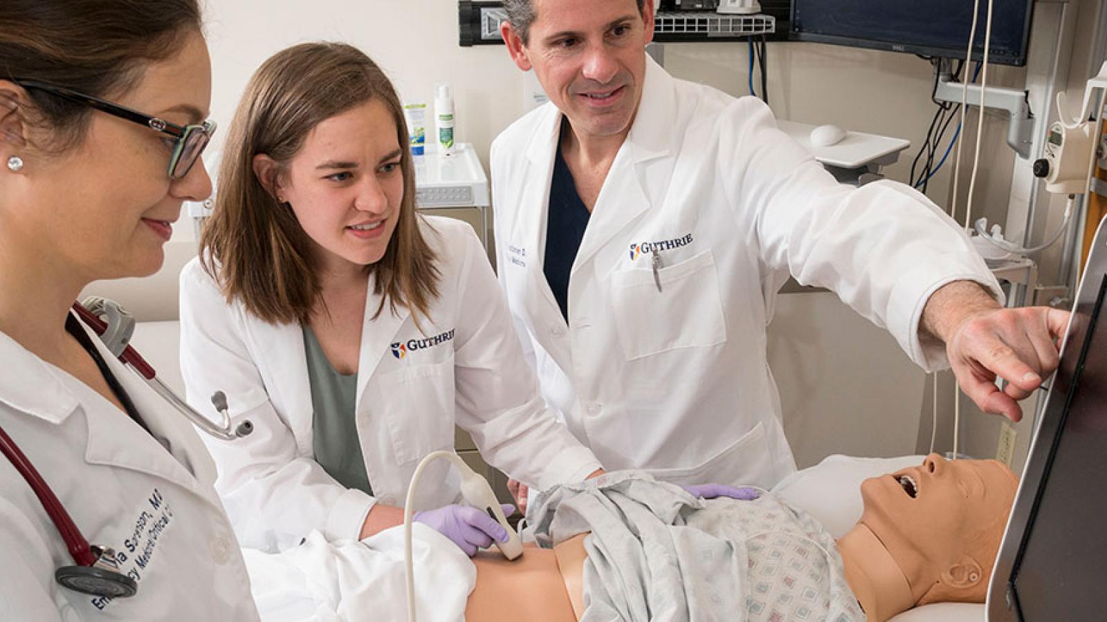 residents working on model patient 