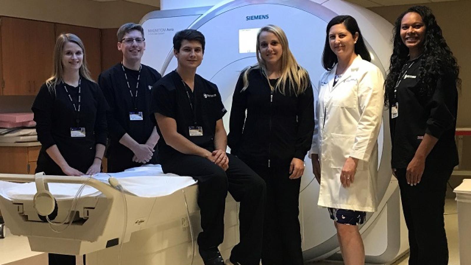 Doctor and nurses with MRI machine 
