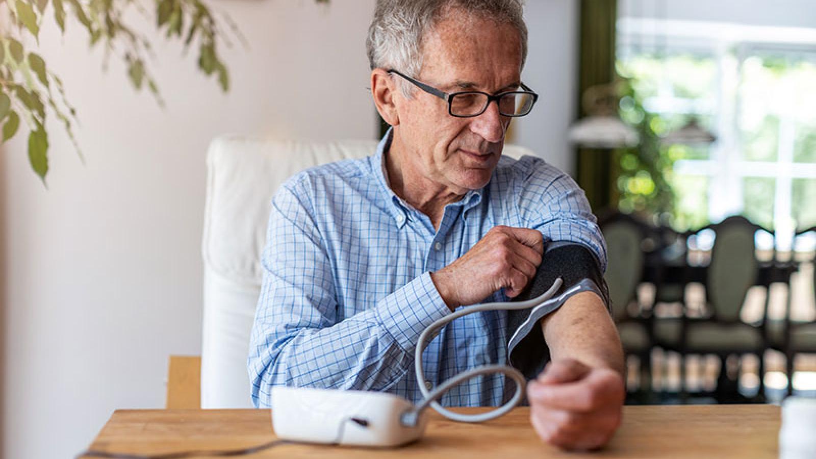 blood pressure cuff on arm - Wyoming Department of Health