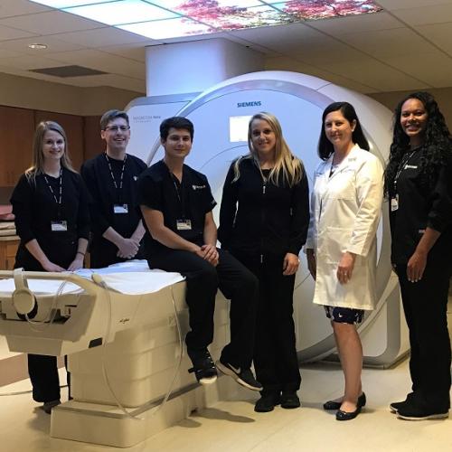 Doctor and nurses with MRI machine 